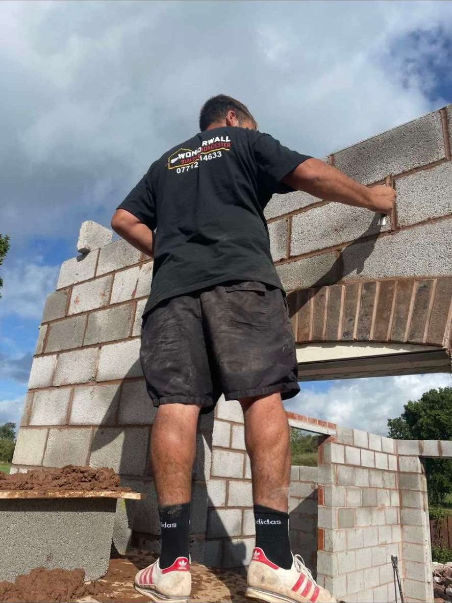 Bricklayer building a new build wall
