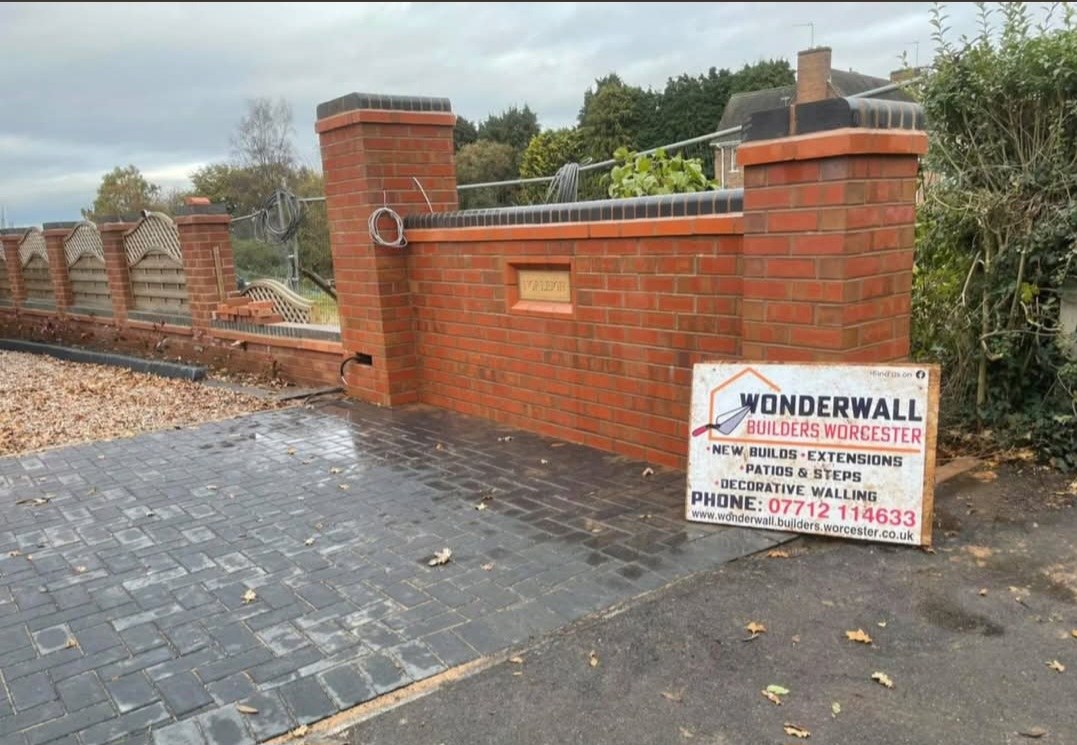 Brick garden wall with piers, block paving and Wonderwall Builders Worcester site board